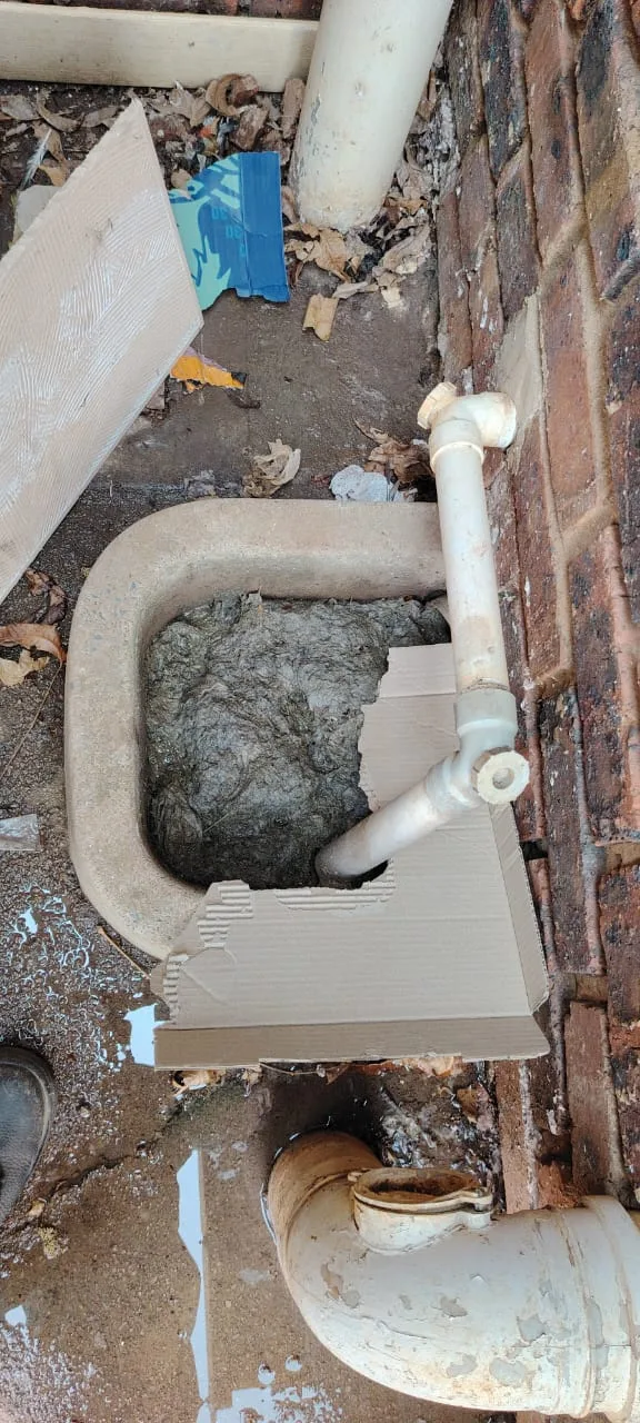 Close-up of blocked drain with standing dirty water and slow flow in Ennerdale
