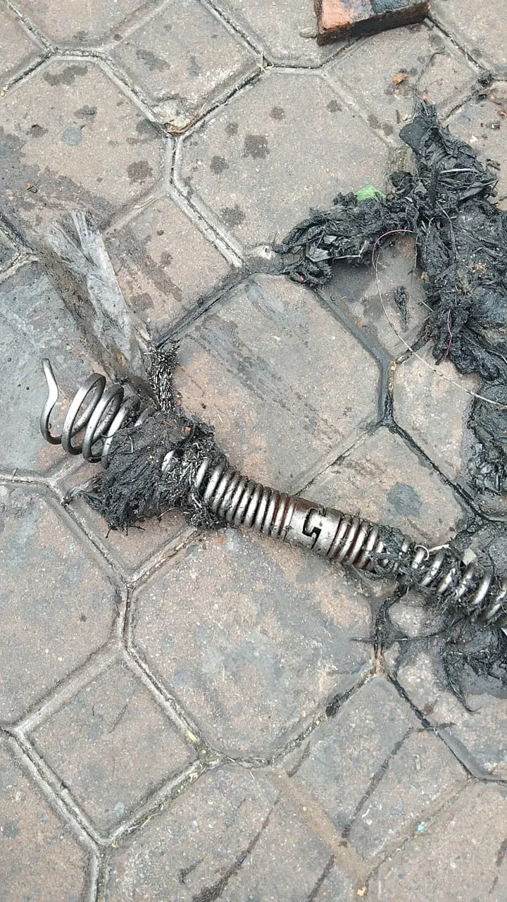 Tree roots removed from a blocked drain pipe