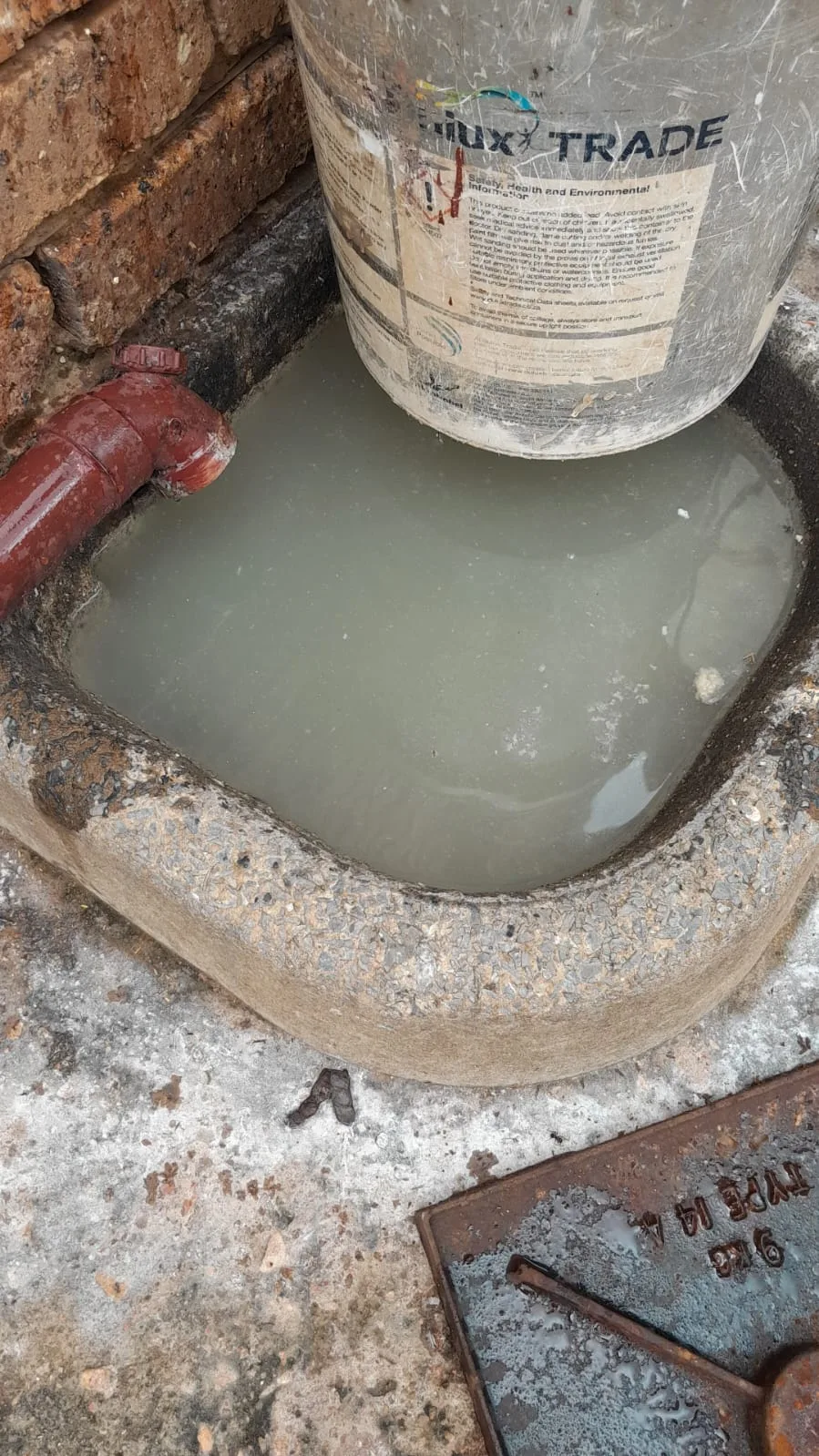 Tree roots removed from a blocked drain pipe