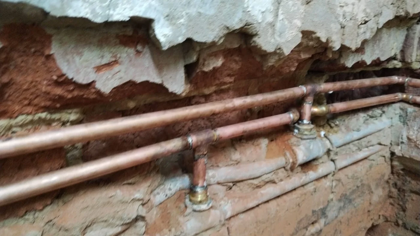 Plumber Aureus — Aureus Plumbing — Plumbers in Aureus — Aureus plumbing call-out Licensed plumber inspecting pipework and fixtures during a service visit in Aureus — leaks, drains, geysers and emergency repairs assessed on site