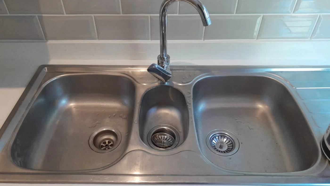 Affordable Plumber Palm Ridge Repairs Installations — Palm Ridge plumbing call-out Licensed plumber inspecting pipework and fixtures during a service visit in Palm Ridge — leaks, drains, geysers and emergency repairs assessed on site