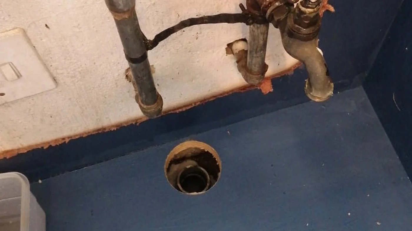 Elton Hill Plumbers Reliable Local Service — Elton Hill plumbing call-out Licensed plumber inspecting pipework and fixtures during a service visit in Elton Hill — leaks, drains, geysers and emergency repairs assessed on site
