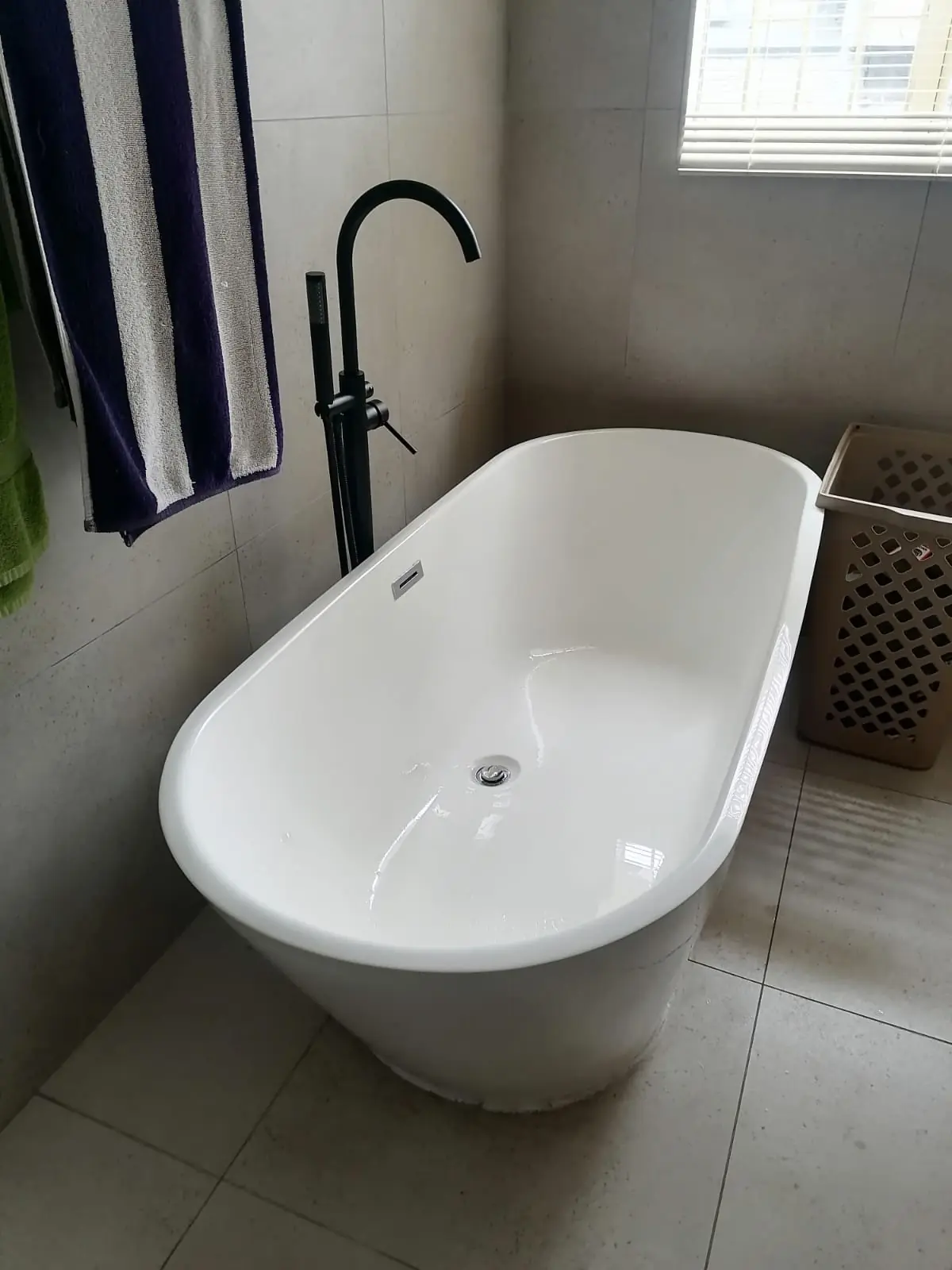 Pressure testing and final checks on renovated bathroom plumbing