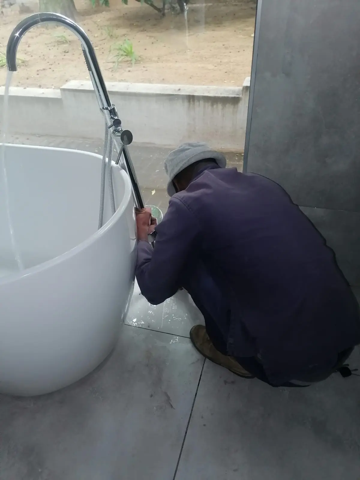 Toilet installation and soil pipe connection during bathroom renovation