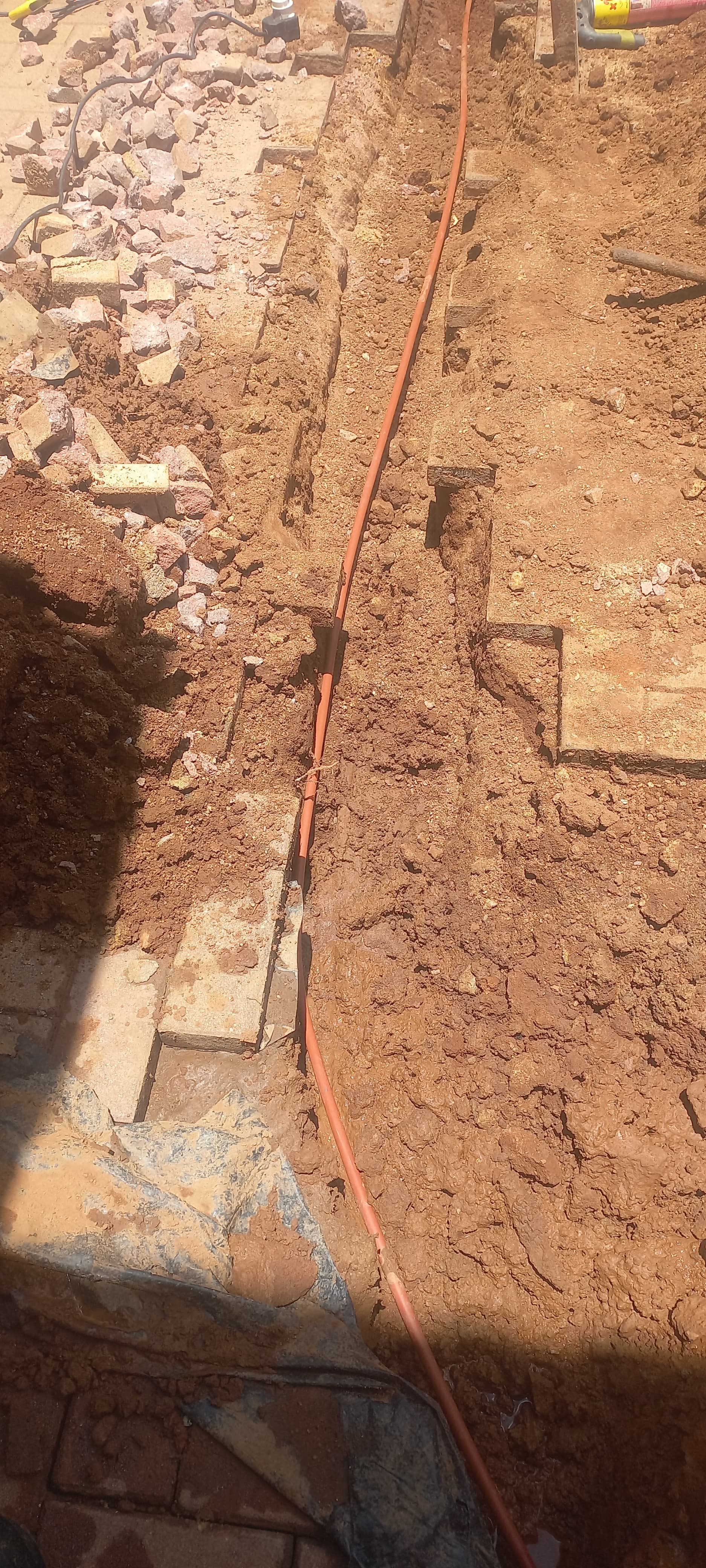 Plumber repairing an active underground water leak