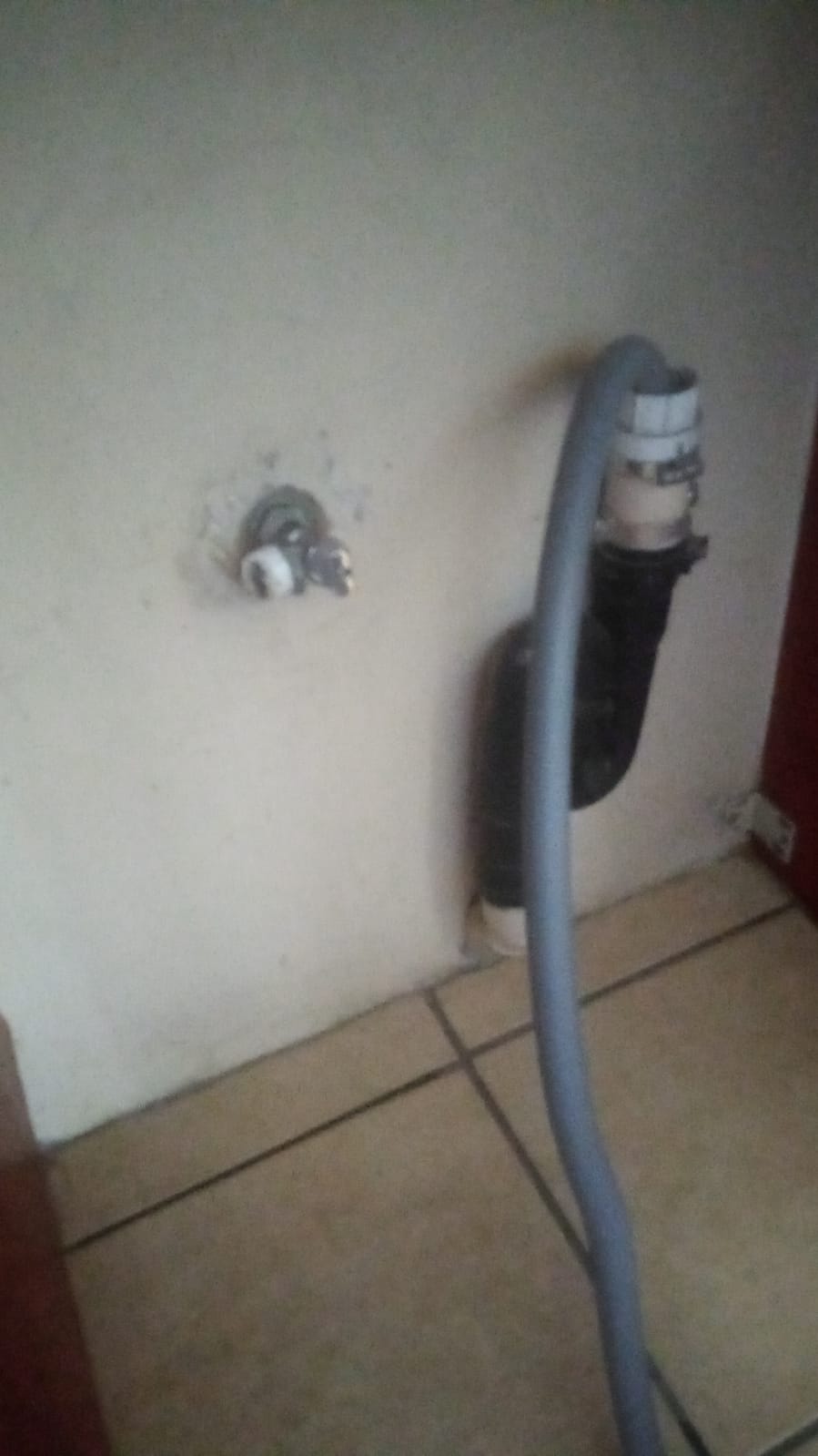 Dishwasher supply hose connected to wall valve