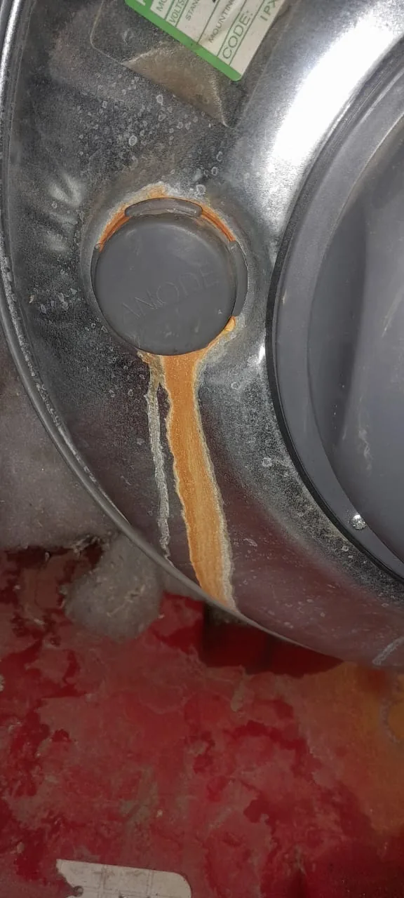 Geyser casing with rust staining and water marks from a leaking geyser