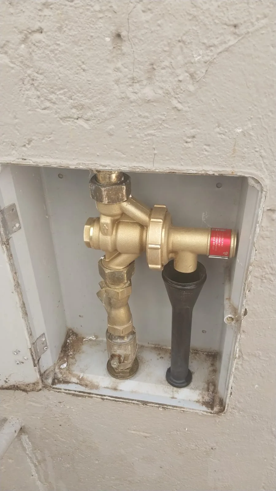 Geyser pressure control valve inside a wall box during repair work