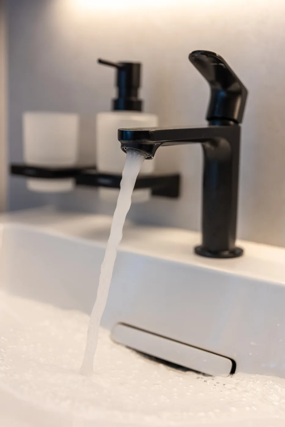 Black basin mixer illustrating plumbing company Kempton Park fixture support