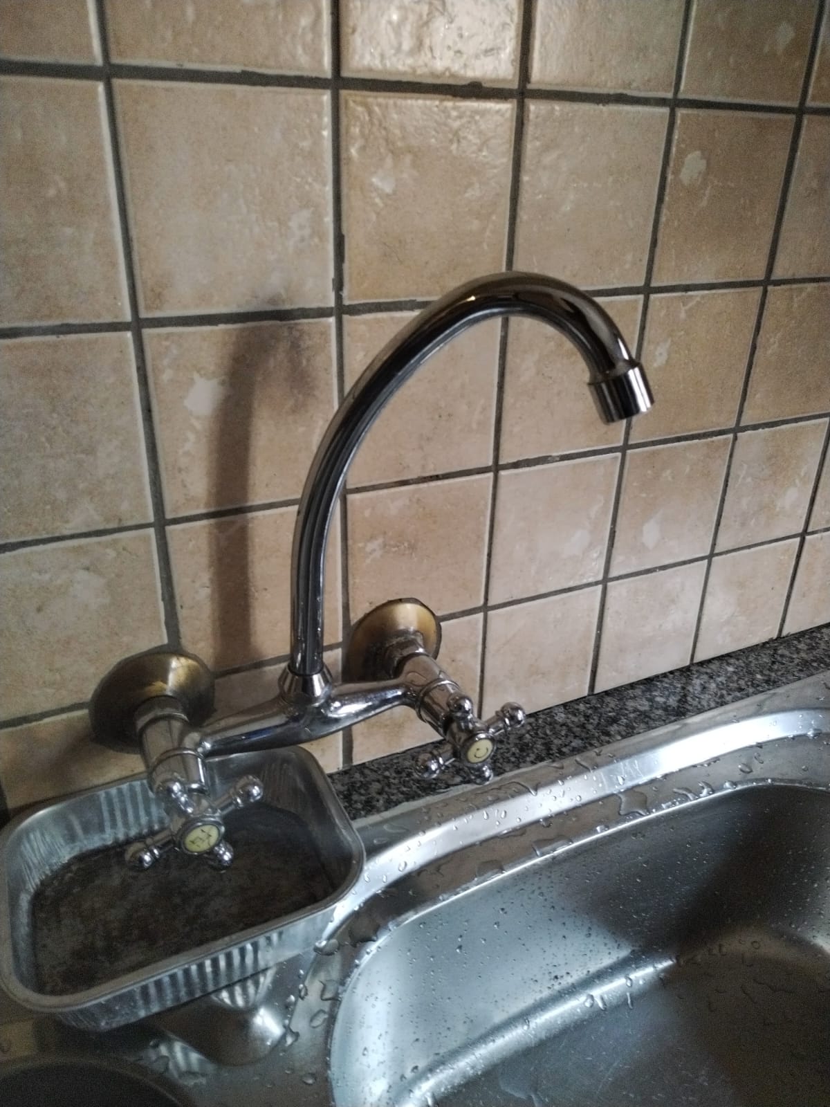 Kitchen mixer tap being repaired at a Boksburg property