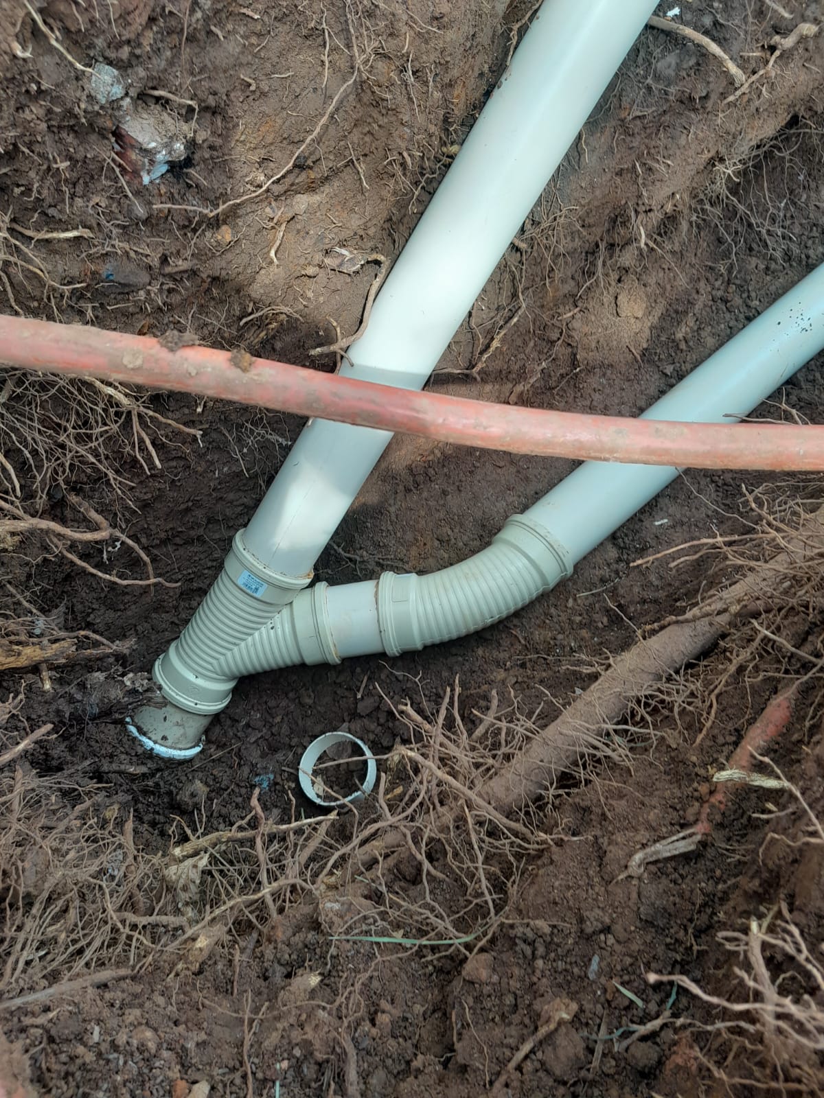 Underground drainage junction exposed for repair in Boksburg