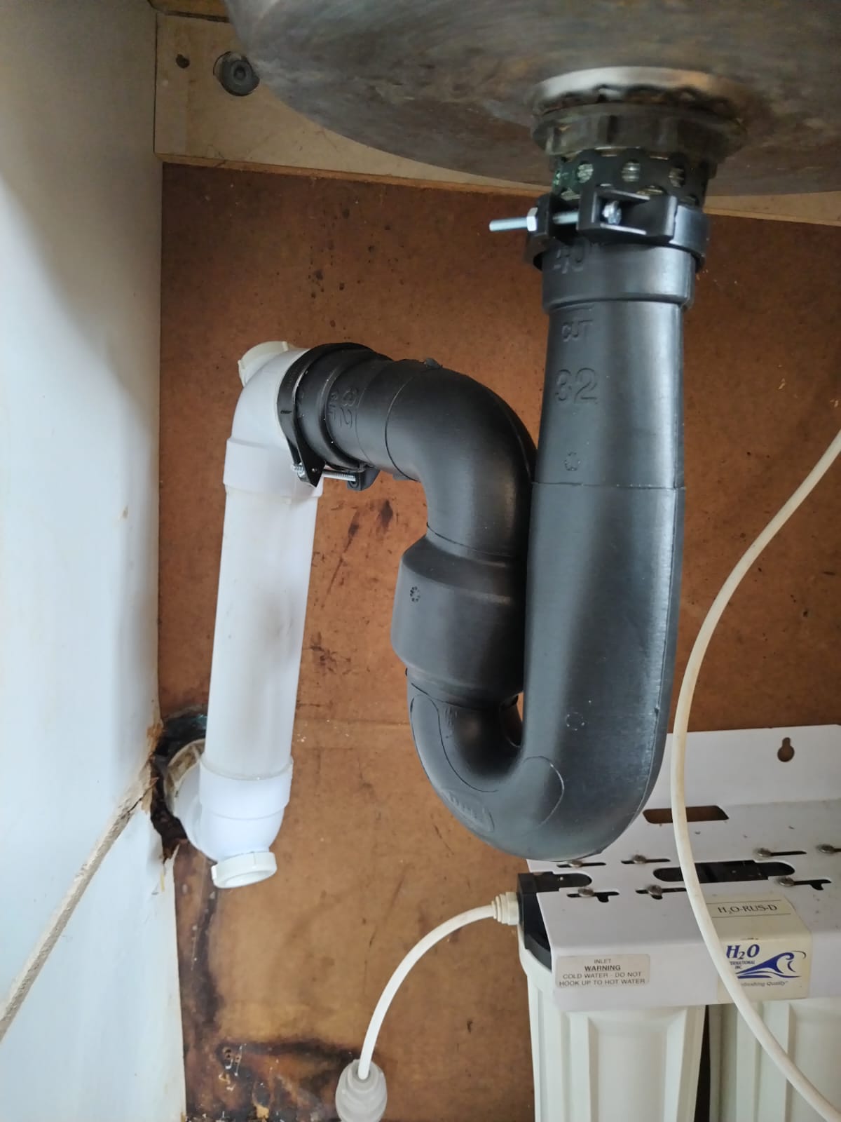 Sink waste trap and drainage pipe installation below a basin in Waterkloof Park