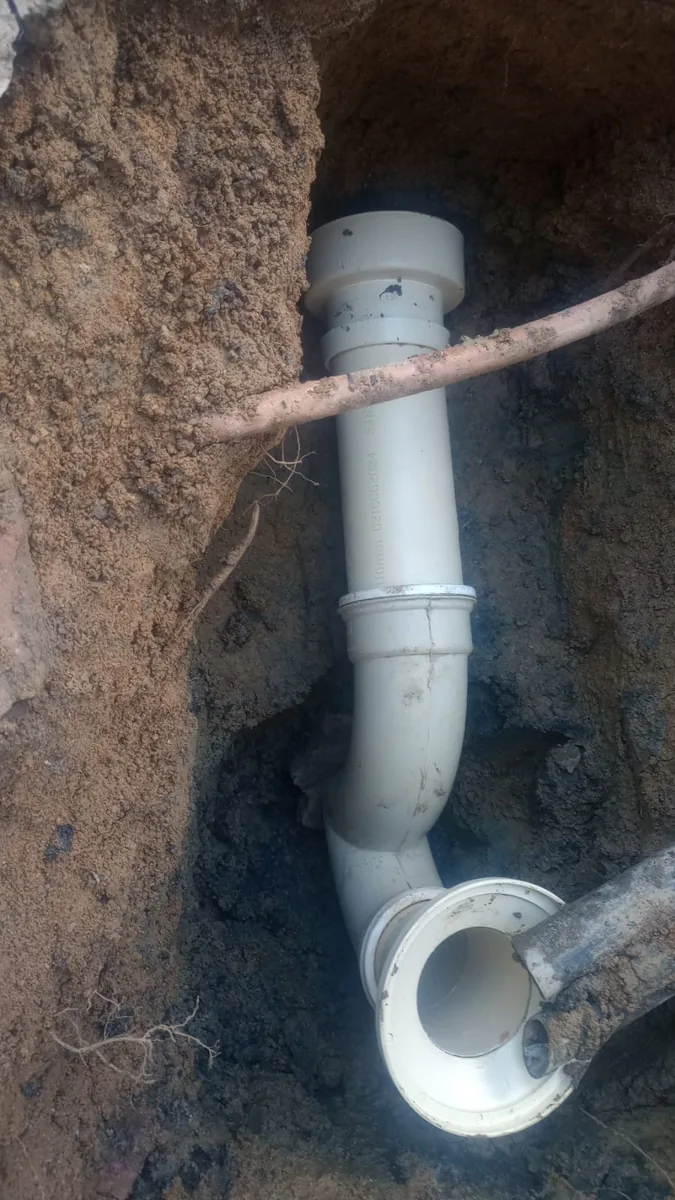 PVC sewer drain pipe section repaired by a Wonderboom plumber