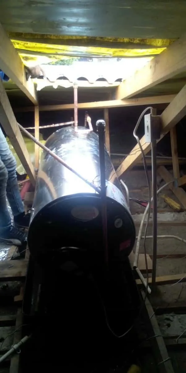 Replacement geyser positioned in roof space before final connection and testing