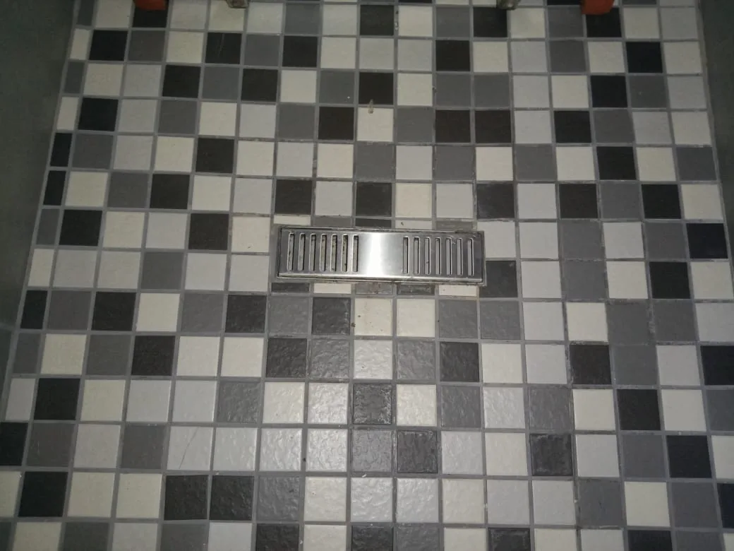 Shower floor drain checked for slow drainage