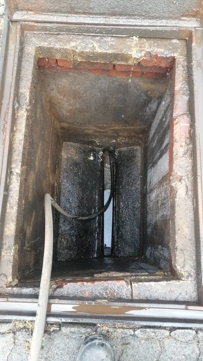 Inspection chamber opened for drain cleaning and flow checking