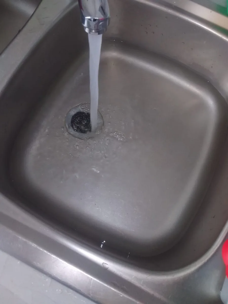 Kitchen sink water draining slowly during blockage assessment