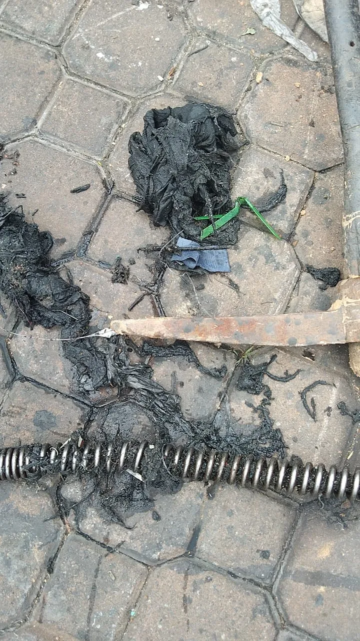 Drain cleaning cable with heavy wipes roots and debris removed from blocked pipe