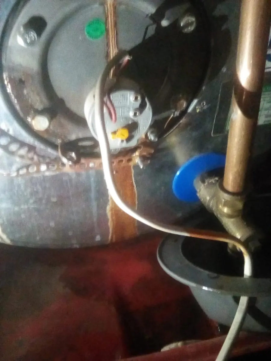 Geyser tripping the power Geyser electrical plate with moisture staining and wiring near a tripping power fault