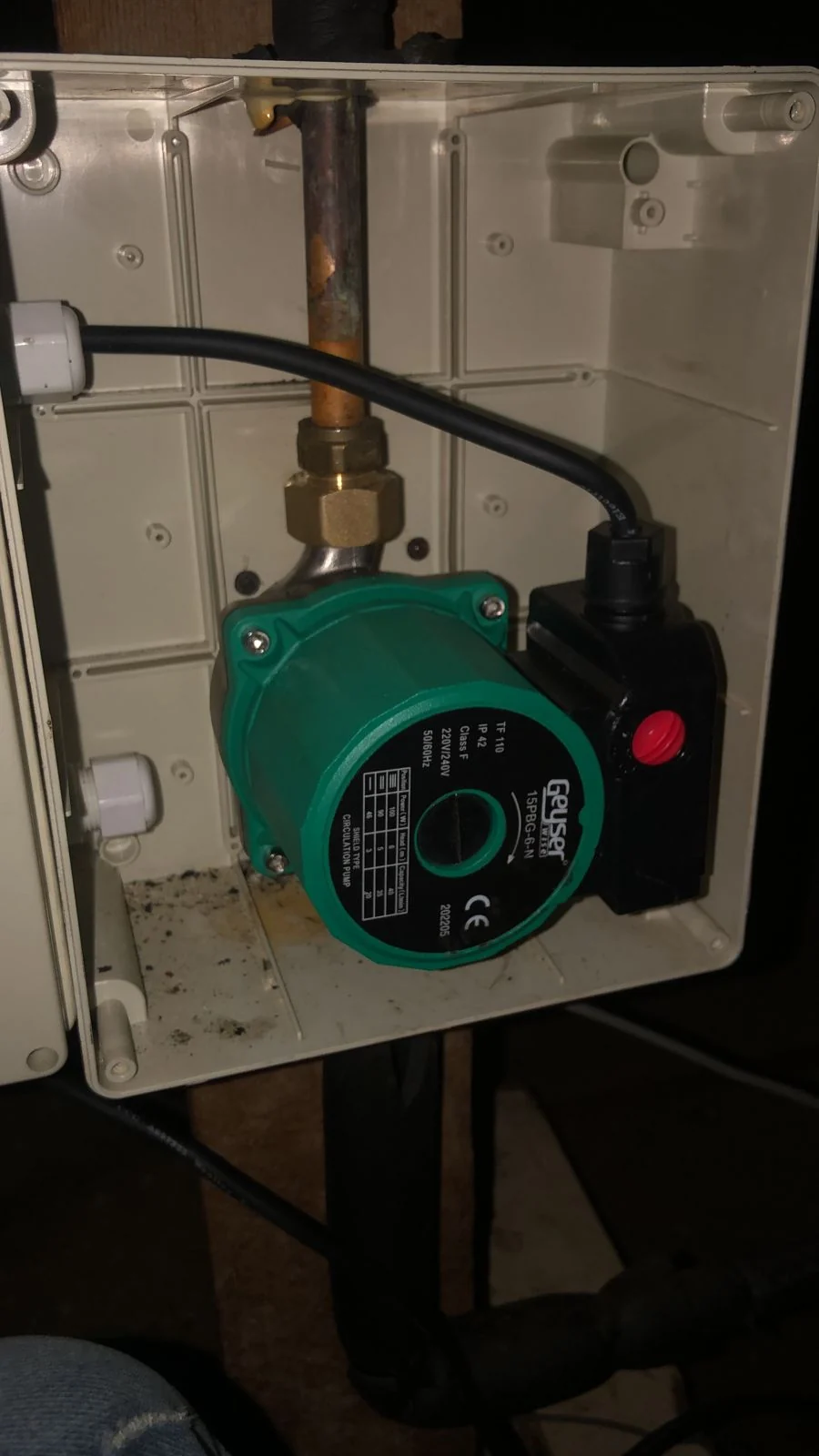 solar geyser circulation pump inside control box with copper pipework and electrical connection