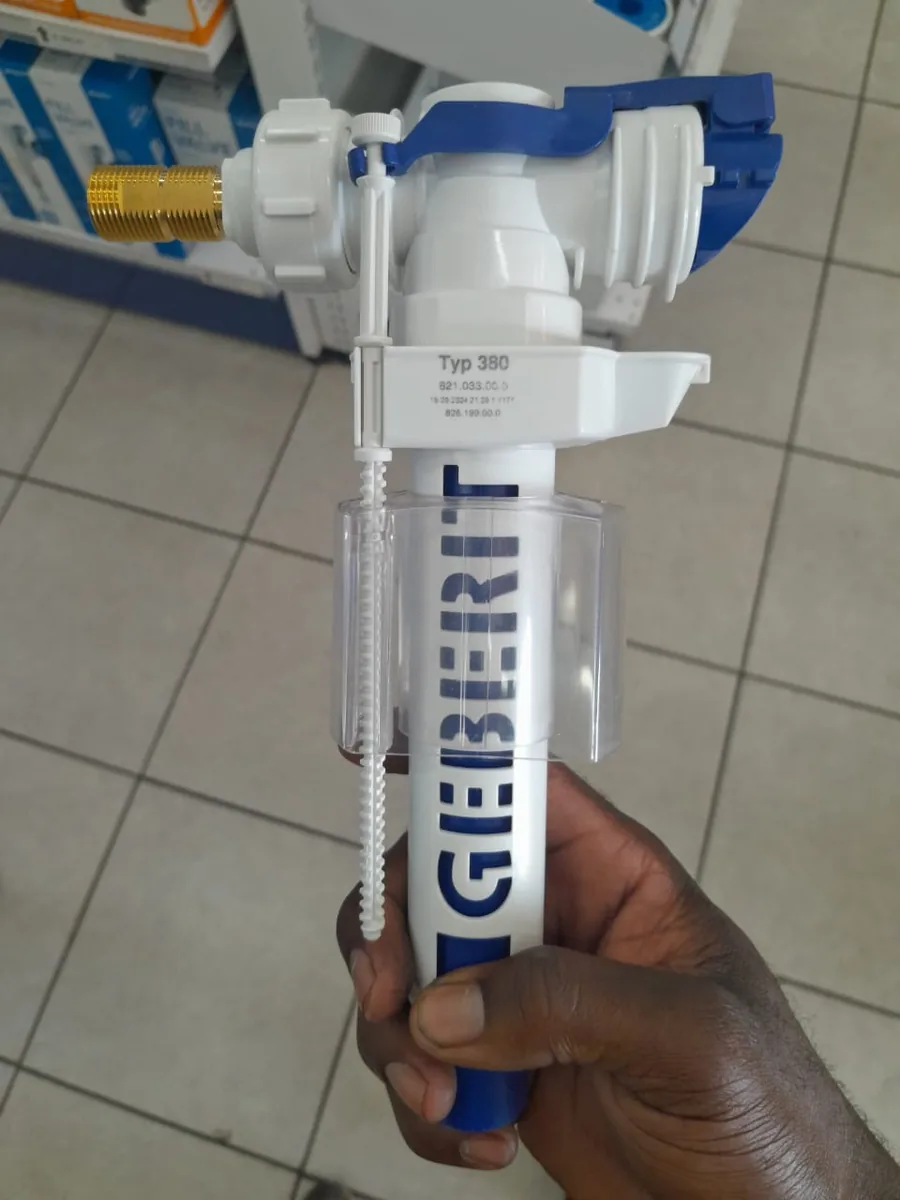 New Geberit Typ 380 toilet fill valve held before installation