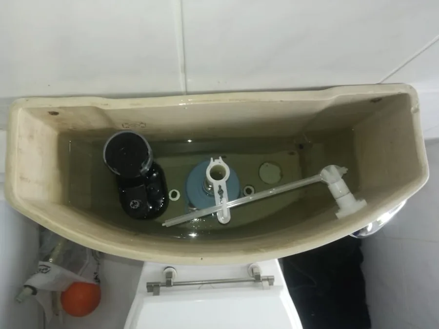 Open toilet cistern showing internal flush and fill components