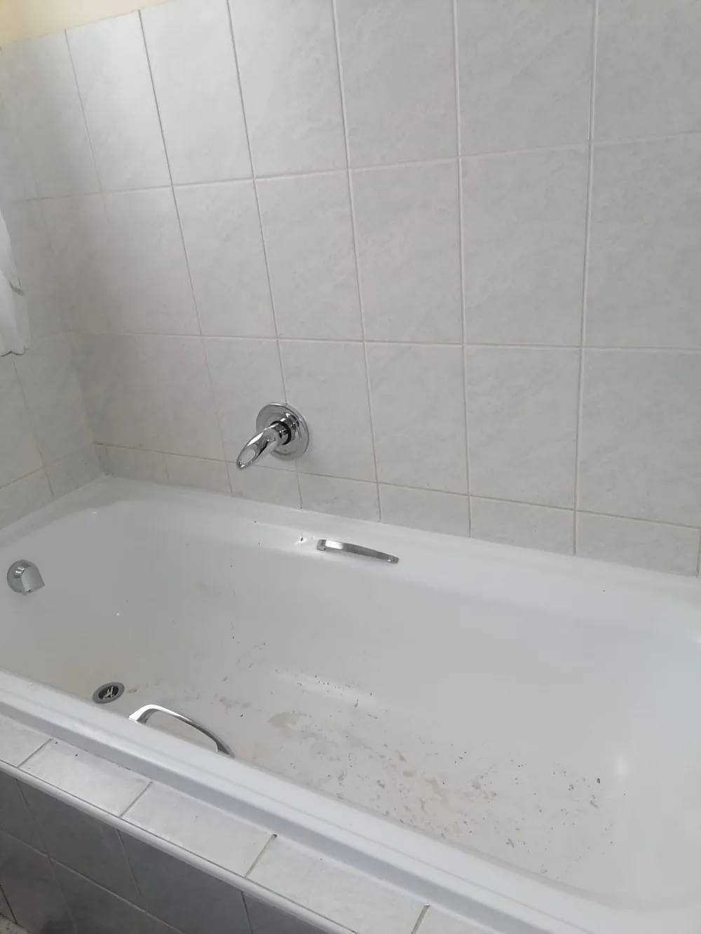 Shower floor with wastewater pooling from a blocked shower drain