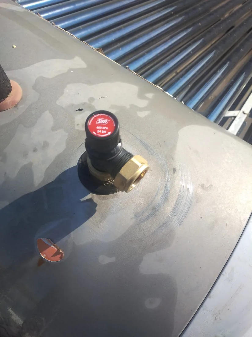 Solar geyser safety valve inspection on a roof-mounted system by a Zandvlei plumber