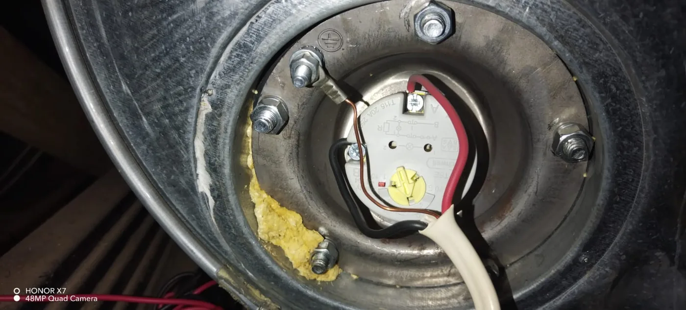 Close-up geyser thermostat and element inspection by a Zeekoevlei plumber