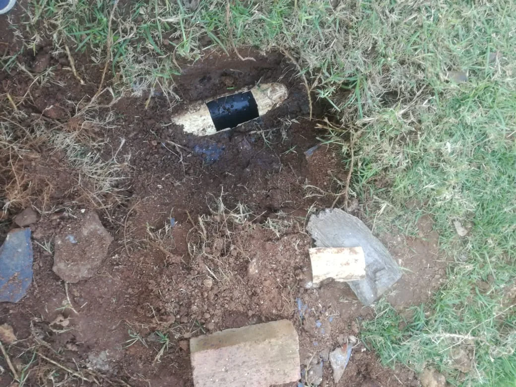 Exposed underground water pipe leak repaired in a Zeekoevlei garden area