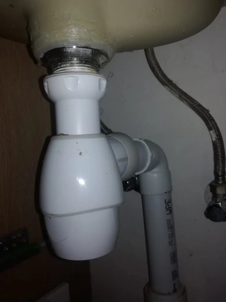 Basin trap and waste repair in Zonnebloem White basin trap and waste pipe repair by a Zonnebloem plumber