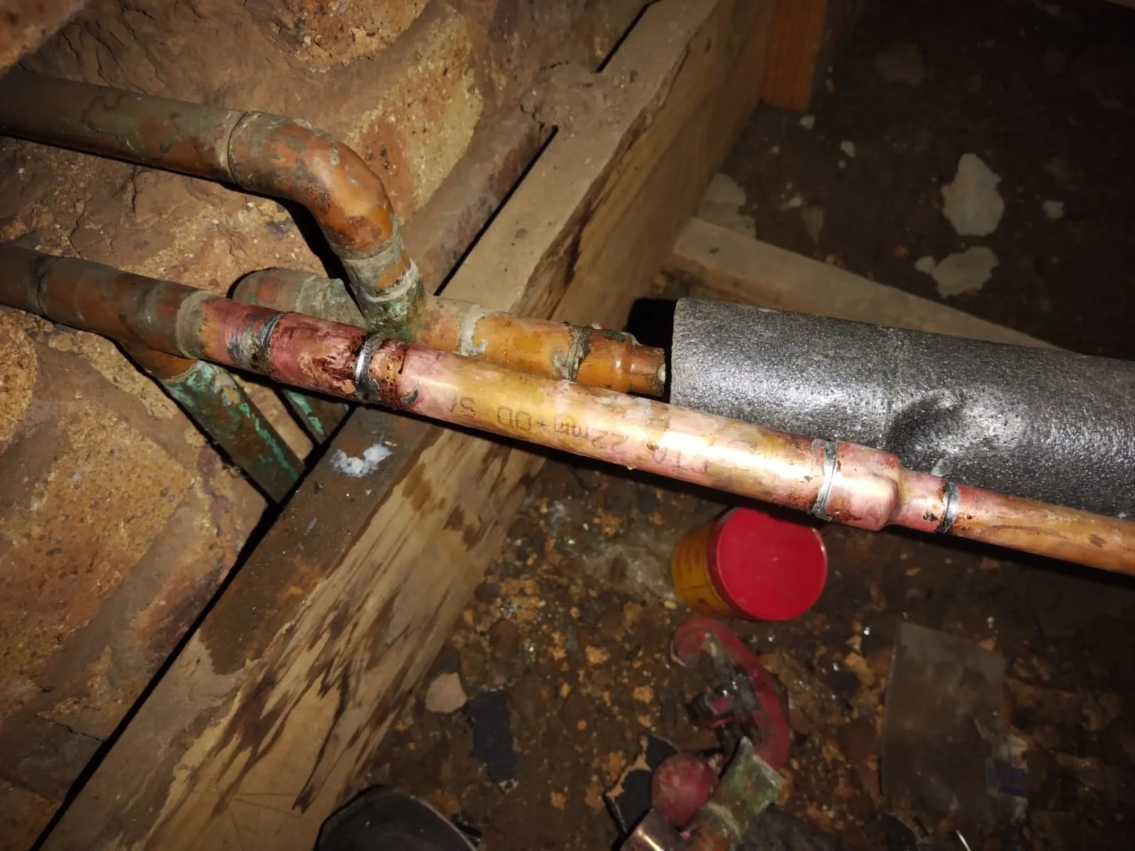 Running water soaking ground from burst outside pipe in Lanseria