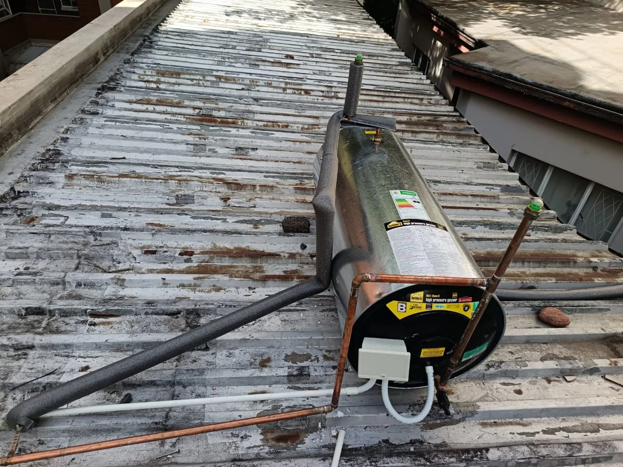 Electric geyser installed safely in a roof space