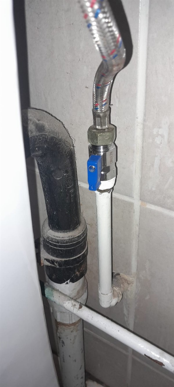 Damp cupboard floor from leaking flexi pipe in Cleveland