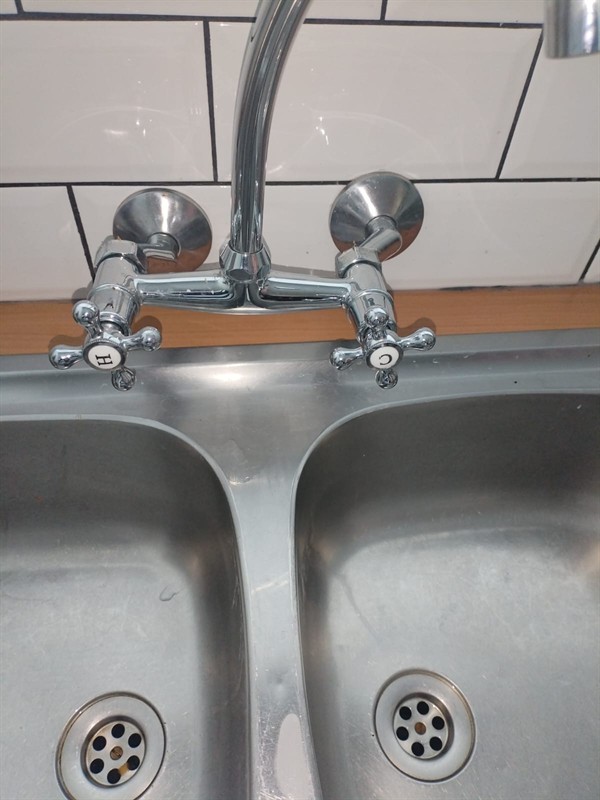 Open hot water geyser during thermostat and element repair in Jukskei Park with internal components visible