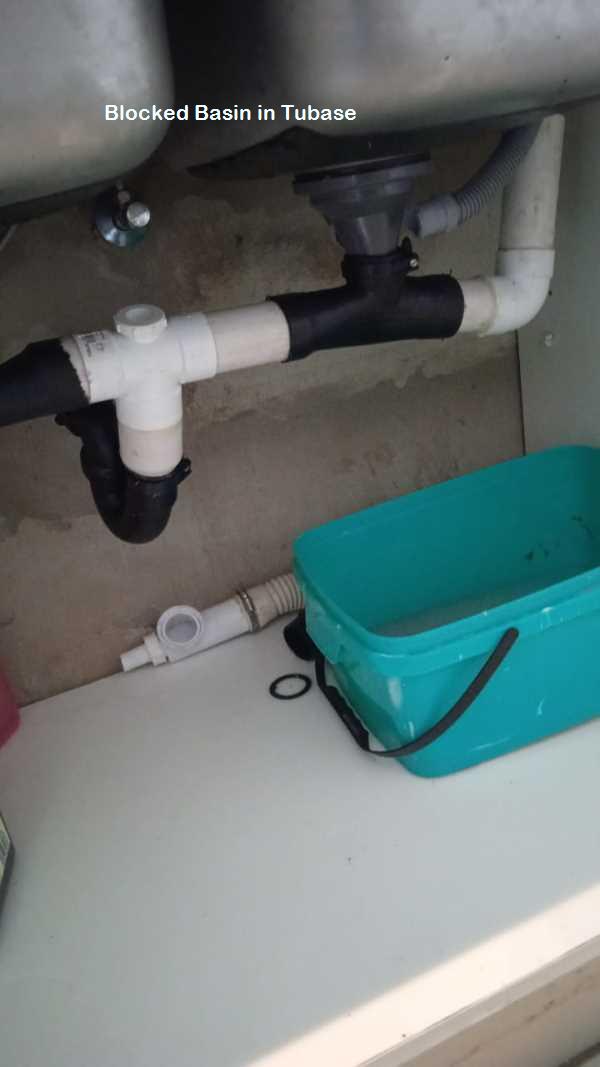 Tubase blocked basin cleaning