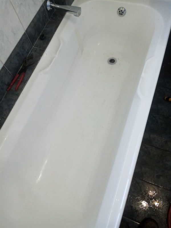 Clogged bath with standing water and debris