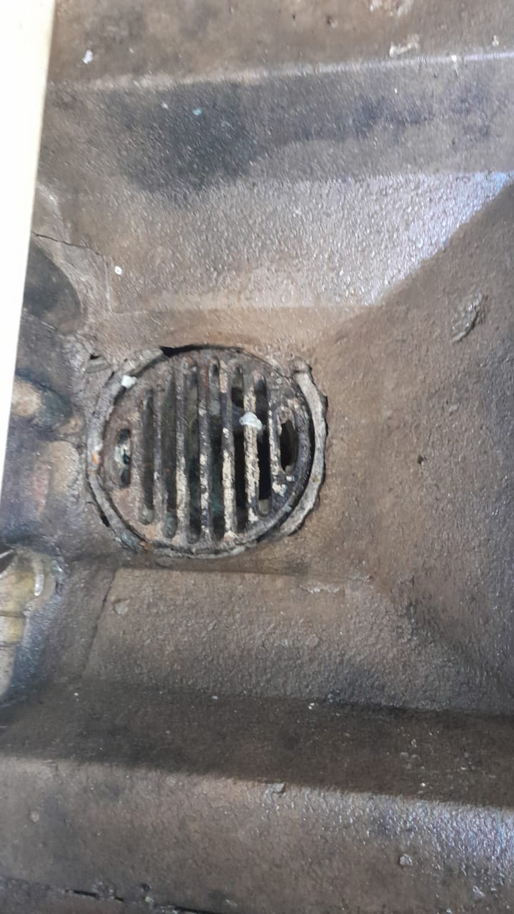 Blocked floor drain in Northcliff showing debris buildup and restricted drainage causing slow water flow and pooling before professional drain cleaning was completed