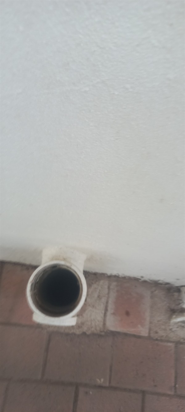 Clog being fixed in drain pipe