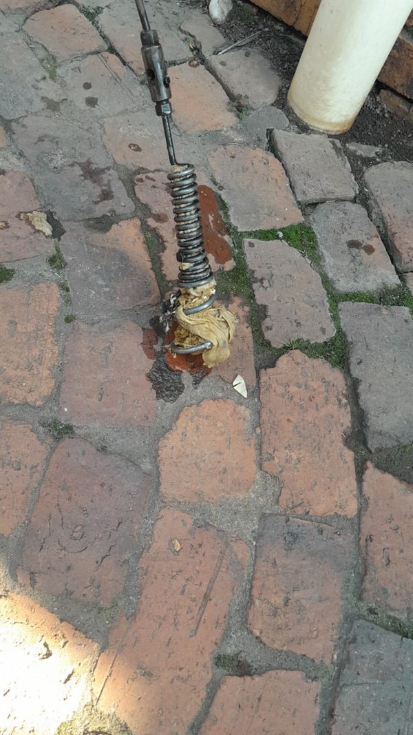 Drain blockage in the process of being cleared