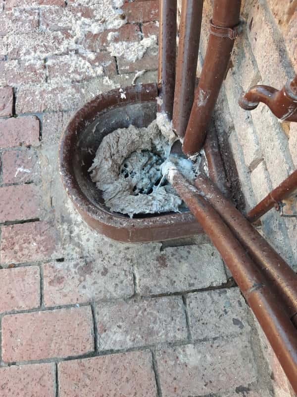 Drain blockage in the process of being cleared