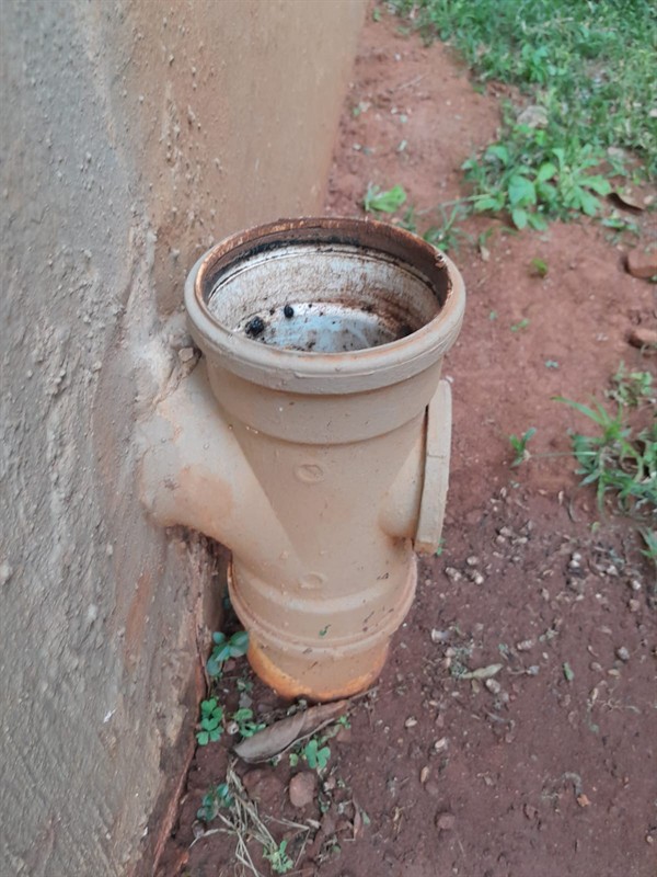 Technician working on blocked sewer pipe