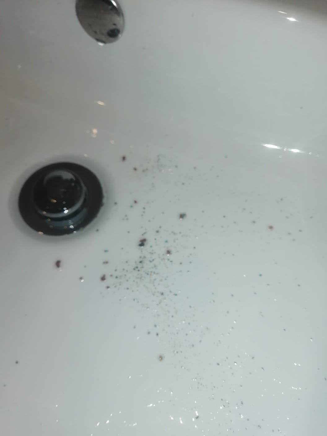 Blocked bathroom sink in Randpark Ridge showing debris and residue buildup in basin causing slow drainage before professional drain cleaning restored proper water flow