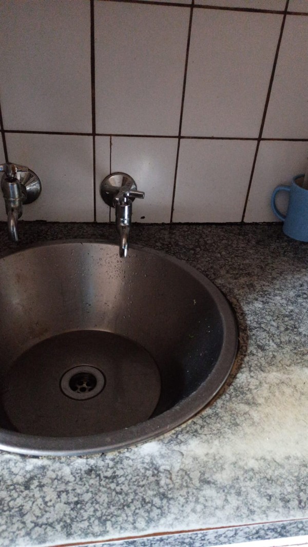 Sink with standing water due to blockage in Inanda