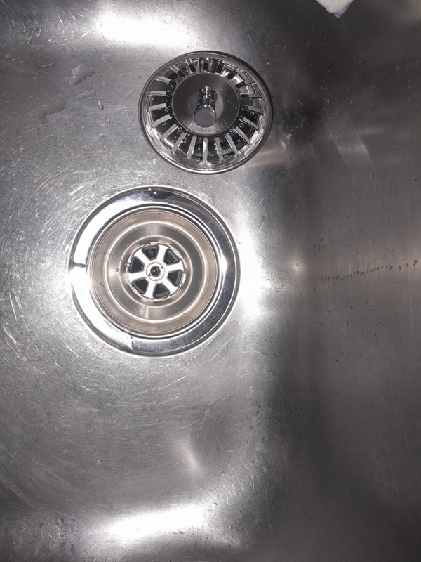 Sludge build-up in blocked sink drain