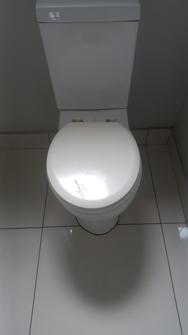Blocked toilet with waste backing up in Johannesburg CBD