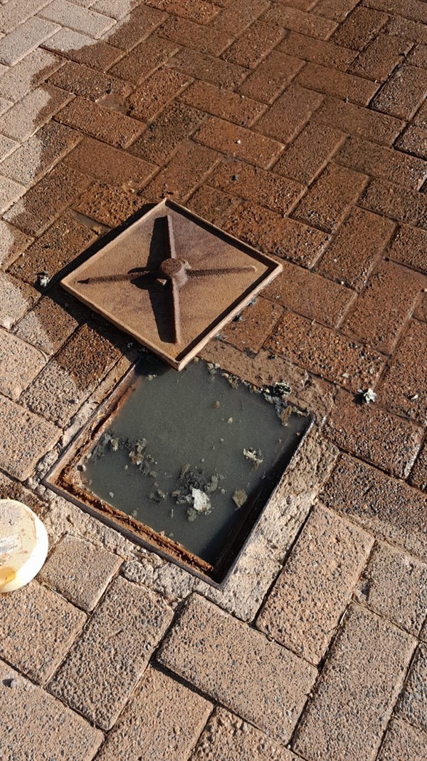 Drain pipe with standing water due to heavy blockage in Bultfontein