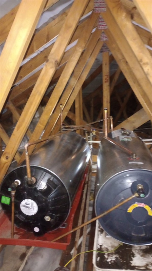 Badly flooding cupboard from burst geyser in Botha