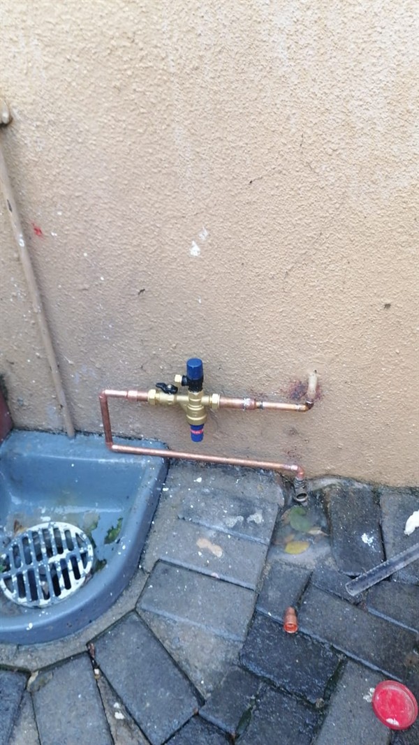 Spreading wet patch from burst outside pipe in Oatlands