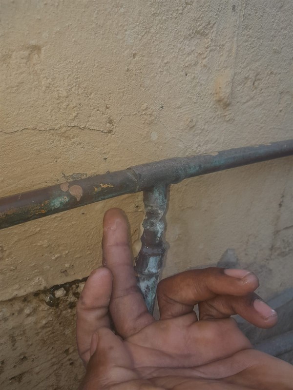 Spraying water from burst outside pipe in Lancaster West